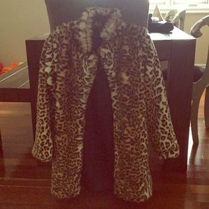 Faux fur leopard lined coat.